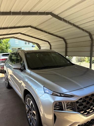Freshly detailed silver Hyundai Santa Fe parked under a carport, Brownsville TX